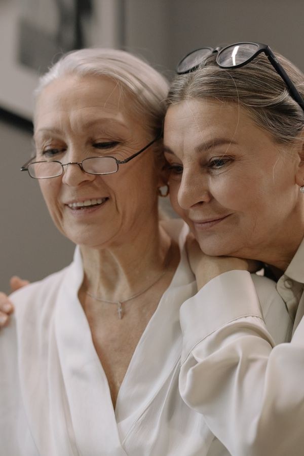 A smiling senior enjoying time with a companion
